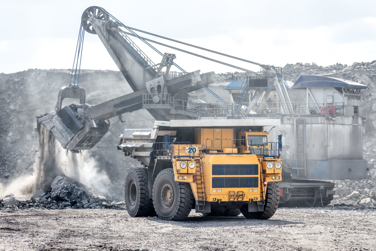 Ore loading with a powerful excavator. Loading a large mining truck. Truck Image